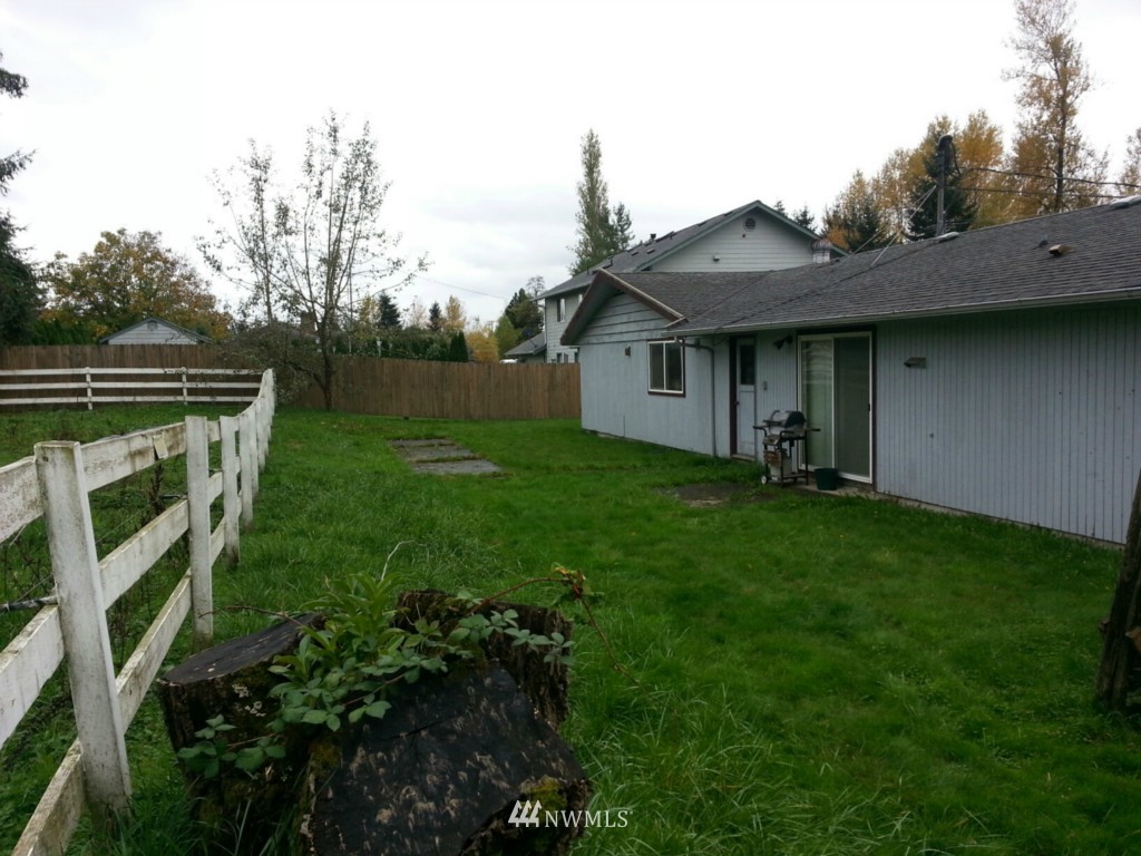 10415 Golden Given Road East Tacoma, WA 98445 - Photo 13 of 14 a backyard of a house with lots of green space