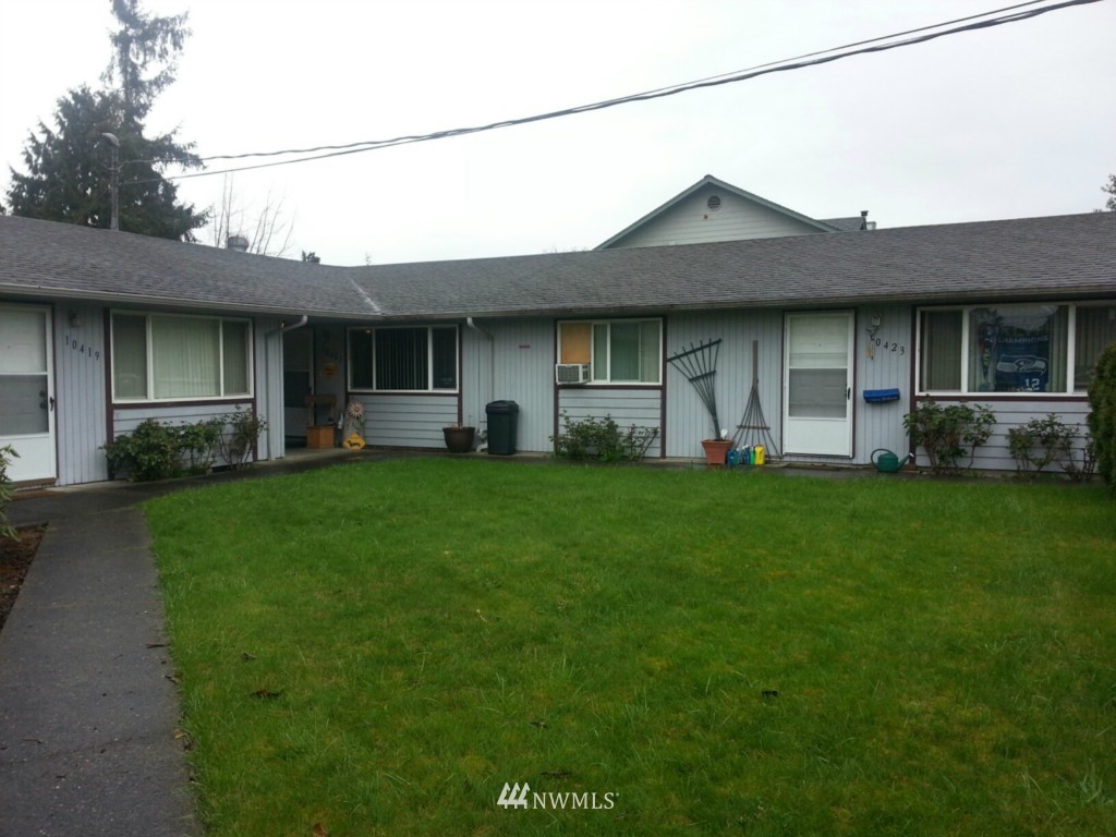 10415 Golden Given Road East Tacoma, WA 98445 - Photo 3 of 14 a house view with a garden space