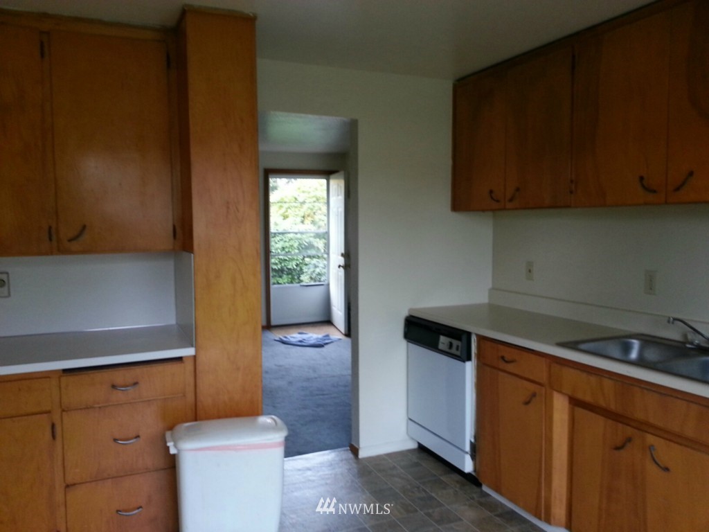 10415 Golden Given Road East Tacoma, WA 98445 - Photo 5 of 14 a kitchen with a sink and a toilet