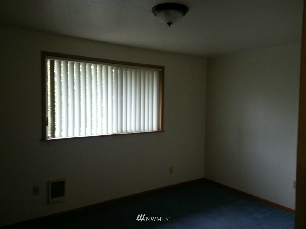 10415 Golden Given Road East Tacoma, WA 98445 - Photo 7 of 14 an empty room with a window