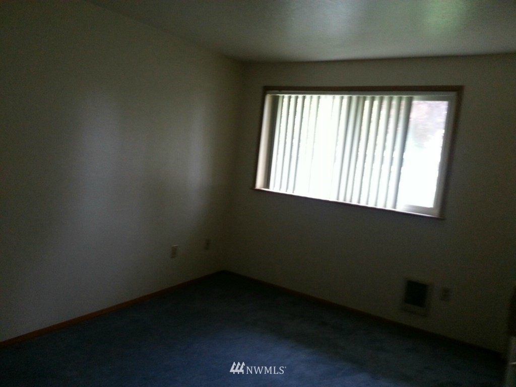 10415 Golden Given Road East Tacoma, WA 98445 - Photo 8 of 14 an empty room with a window