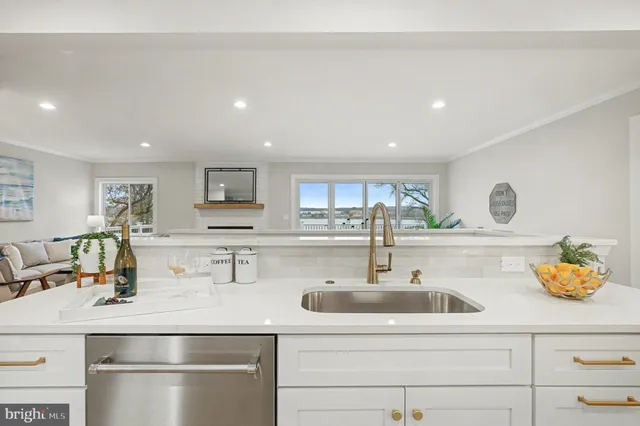 a view of a patio with table and chairs