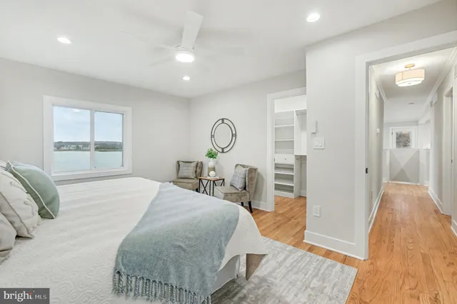 a bedroom with bed and a furniture