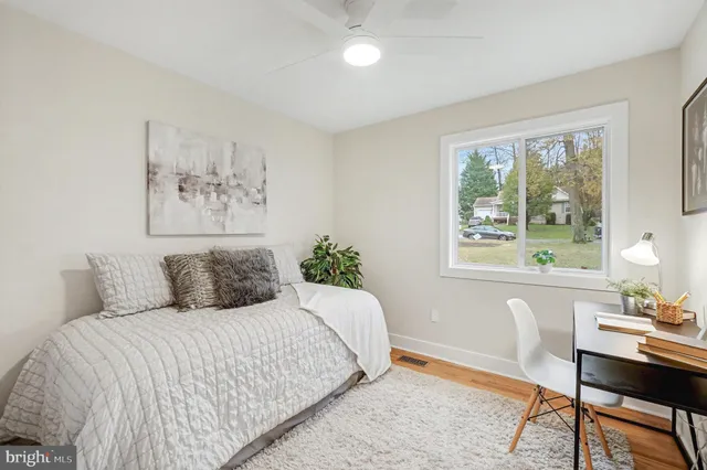 a view of a livingroom with furniture and a potted plant