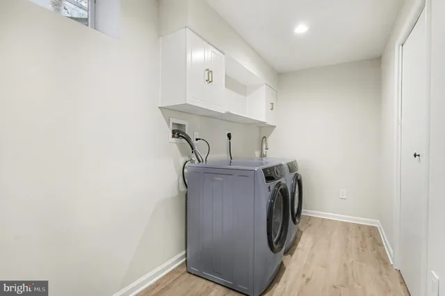 a spacious bathroom with a toilet a sink and mirror
