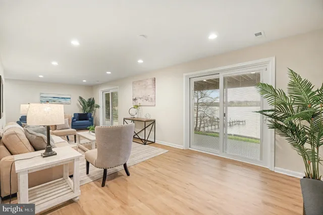 a view of a house with a wooden deck