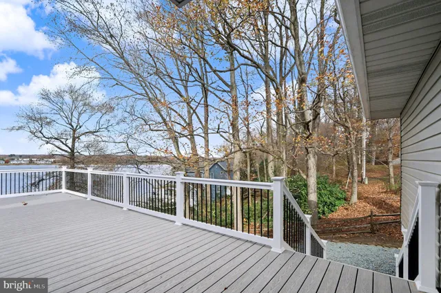 a street sign on a sidewalk next to a road