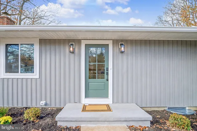 a view of a kitchen with wooden floor and a refrigerator