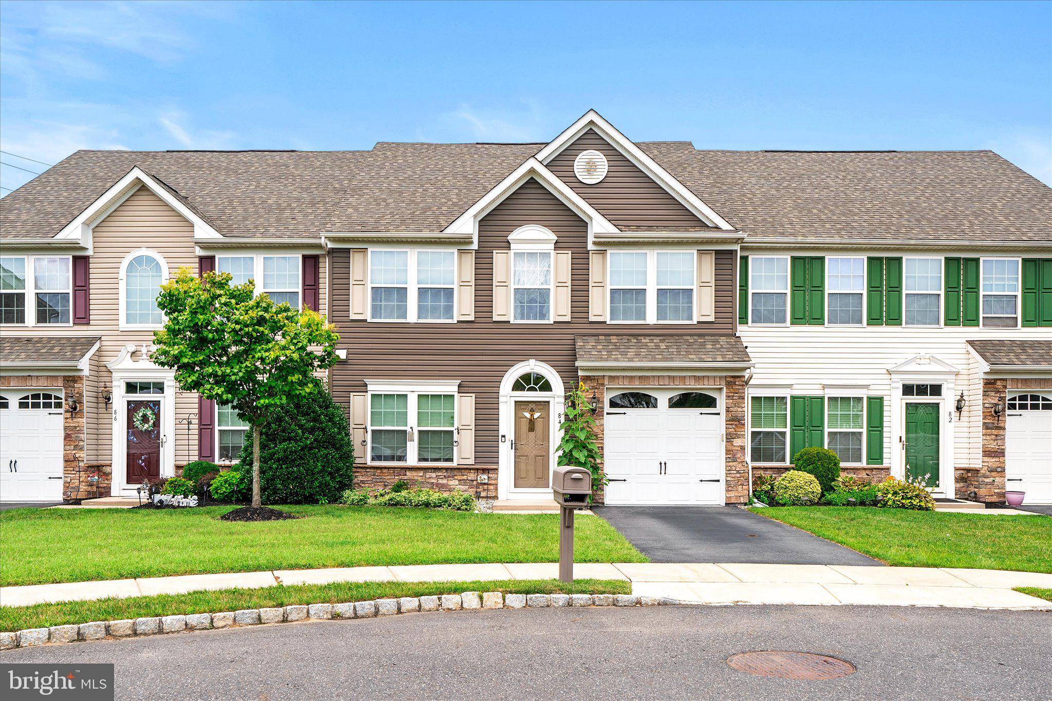 84 Heals Farm Road Burlington, NJ 08016 - Photo 2 of 33 a front view of a house with a yard and garage