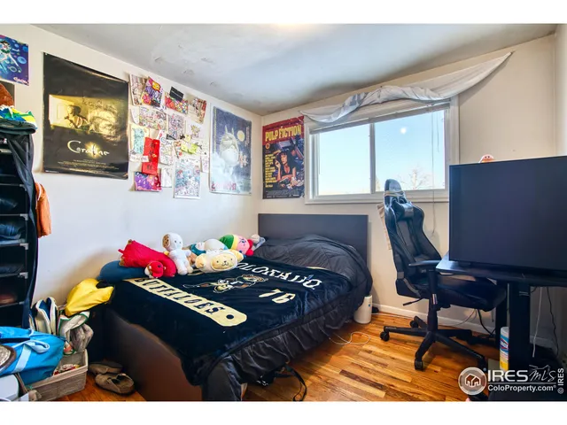 a bedroom with a bed and dresser