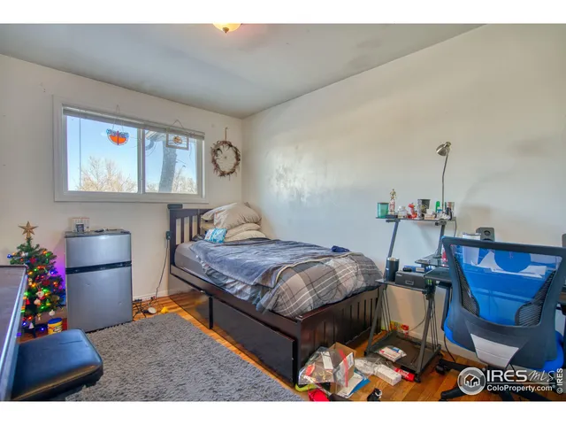 a bedroom with furniture and a bed