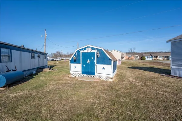 a swimming pool view with a outdoor seating space