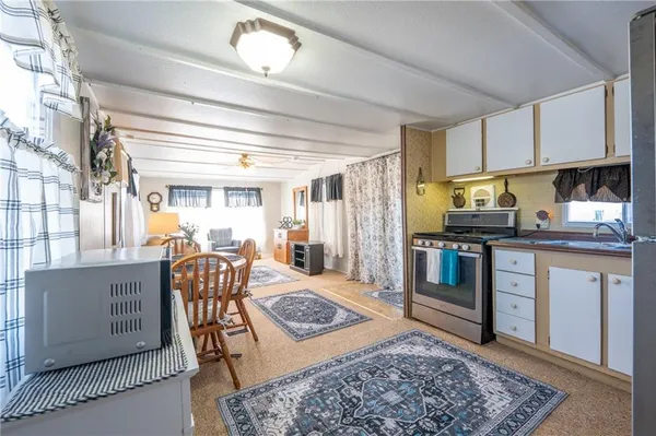 a living room with furniture and a rug