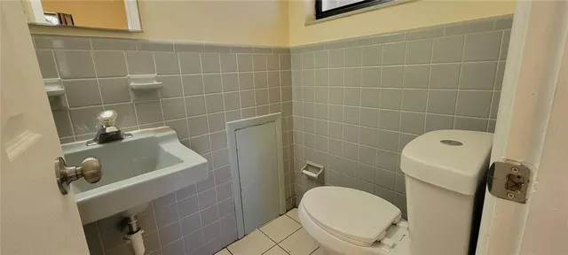 a bathroom with a toilet and a sink