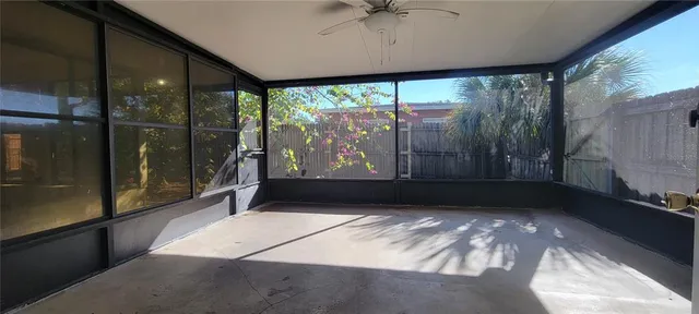 a view of a glass door with a yard