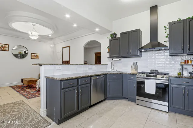 a bed sitting in a bedroom next to a bathroom
