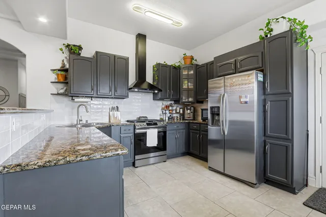 a bedroom with a bed and a lamp