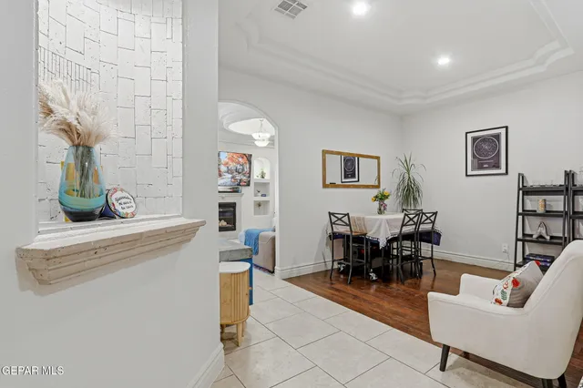 a kitchen with granite countertop a refrigerator and a sink