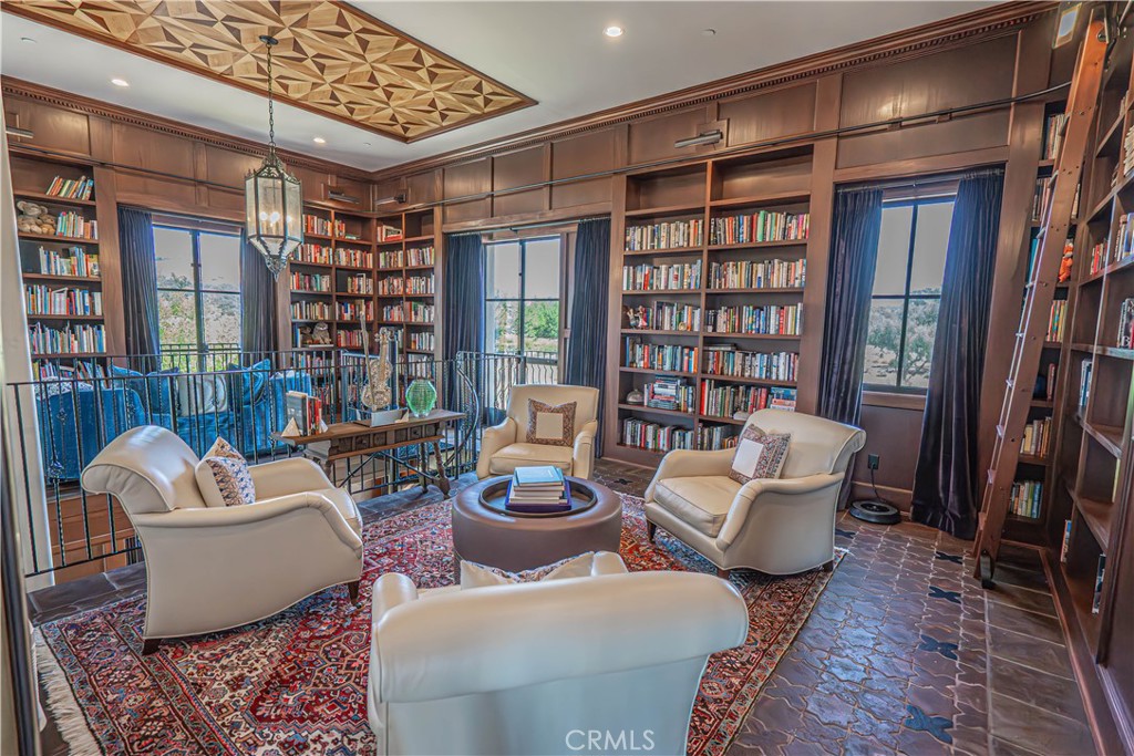 3030 Templeton Road Templeton, CA 93465 - Photo 23 of 75 The upper library offers a serene retreat, complete with custom bookshelves and expansive views — perfect for quiet reading and relaxation.