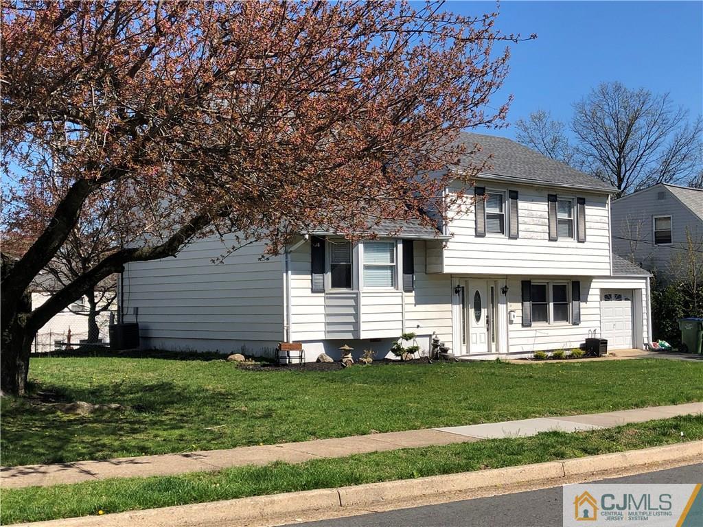 13 Phillips Road Edison, NJ 08817 - Photo 2 of 25 a front view of a house with a yard table and chairs