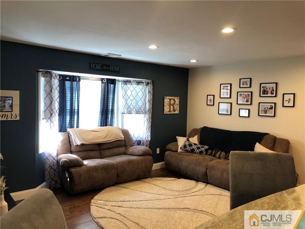13 Phillips Road Edison, NJ 08817 - Photo 11 of 25 a living room with furniture and a window