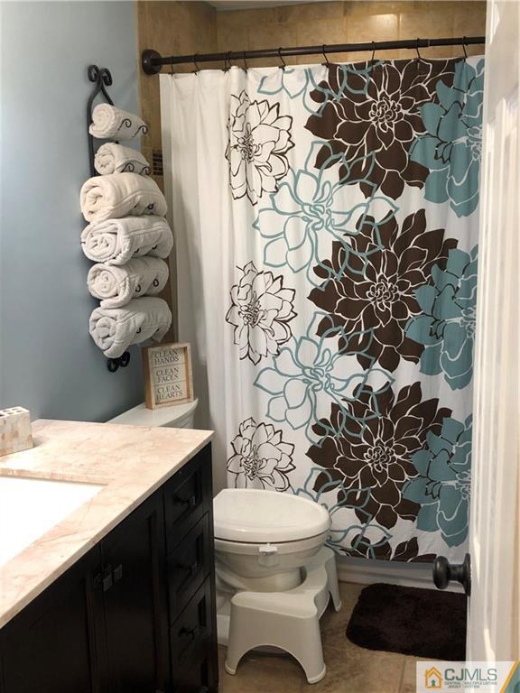 13 Phillips Road Edison, NJ 08817 - Photo 14 of 25 a bathroom with a sink toilet and shower