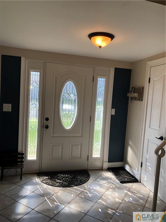13 Phillips Road Edison, NJ 08817 - Photo 3 of 25 a view of a entryway door with wooden floor