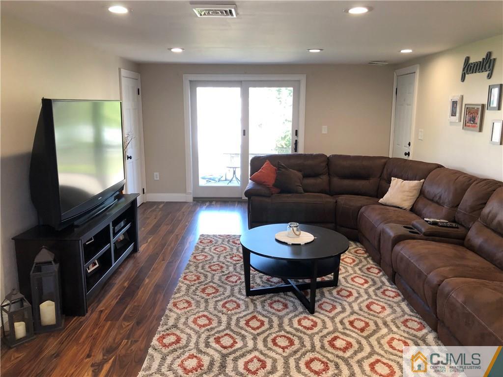 13 Phillips Road Edison, NJ 08817 - Photo 5 of 25 a living room with furniture and a flat screen tv