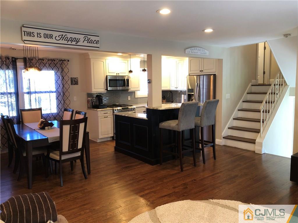 13 Phillips Road Edison, NJ 08817 - Photo 10 of 25 a view of a dining room with furniture window and wooden floor