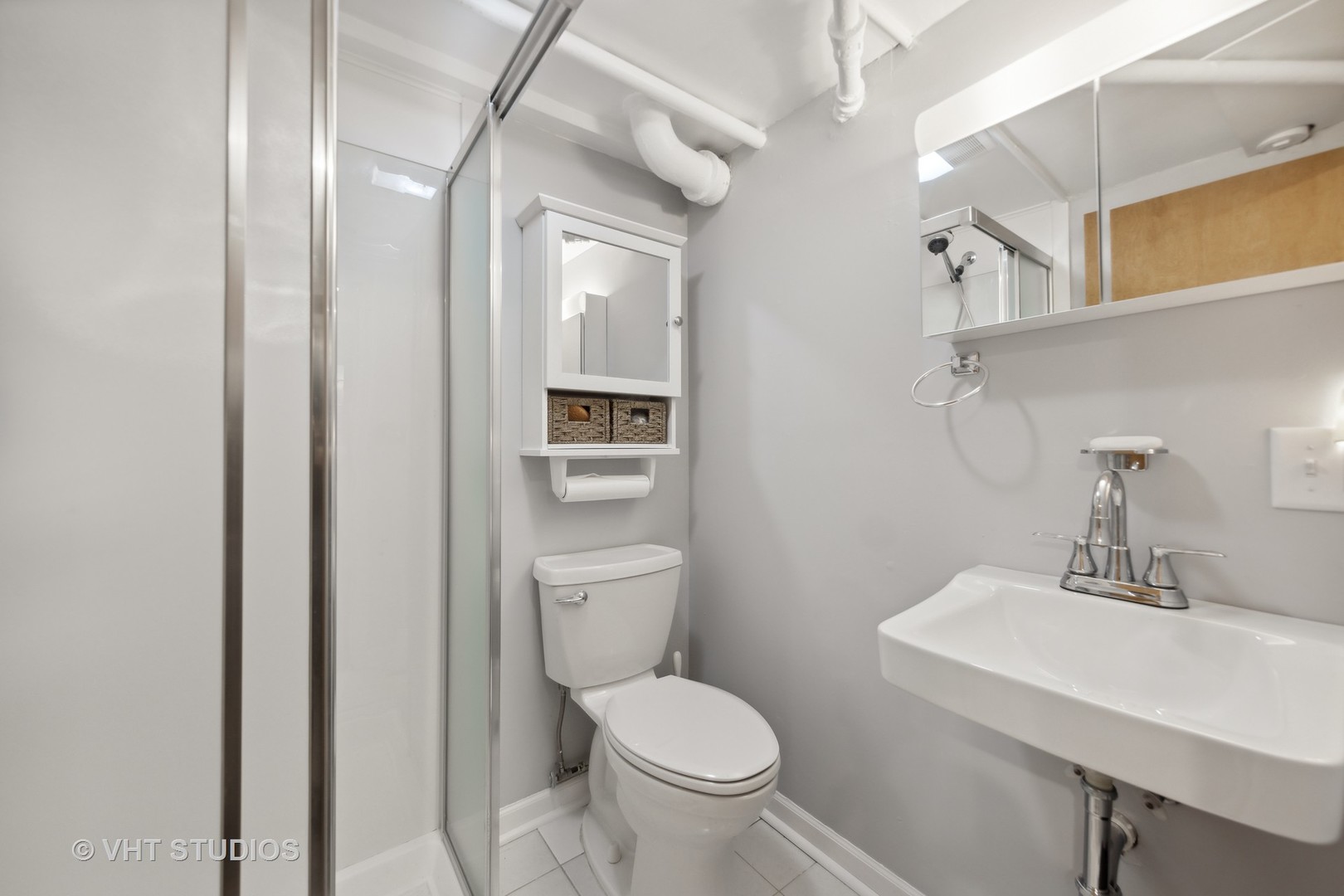 831 Warrenville Road Wheaton, IL 60189 - Photo 17 of 26 a bathroom with a toilet sink and mirror