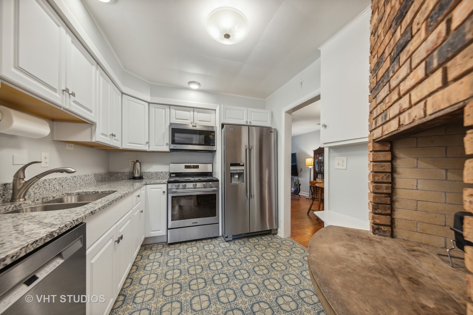 831 Warrenville Road Wheaton, IL 60189 - Photo 5 of 26 a kitchen with stainless steel appliances granite countertop a refrigerator and a sink
