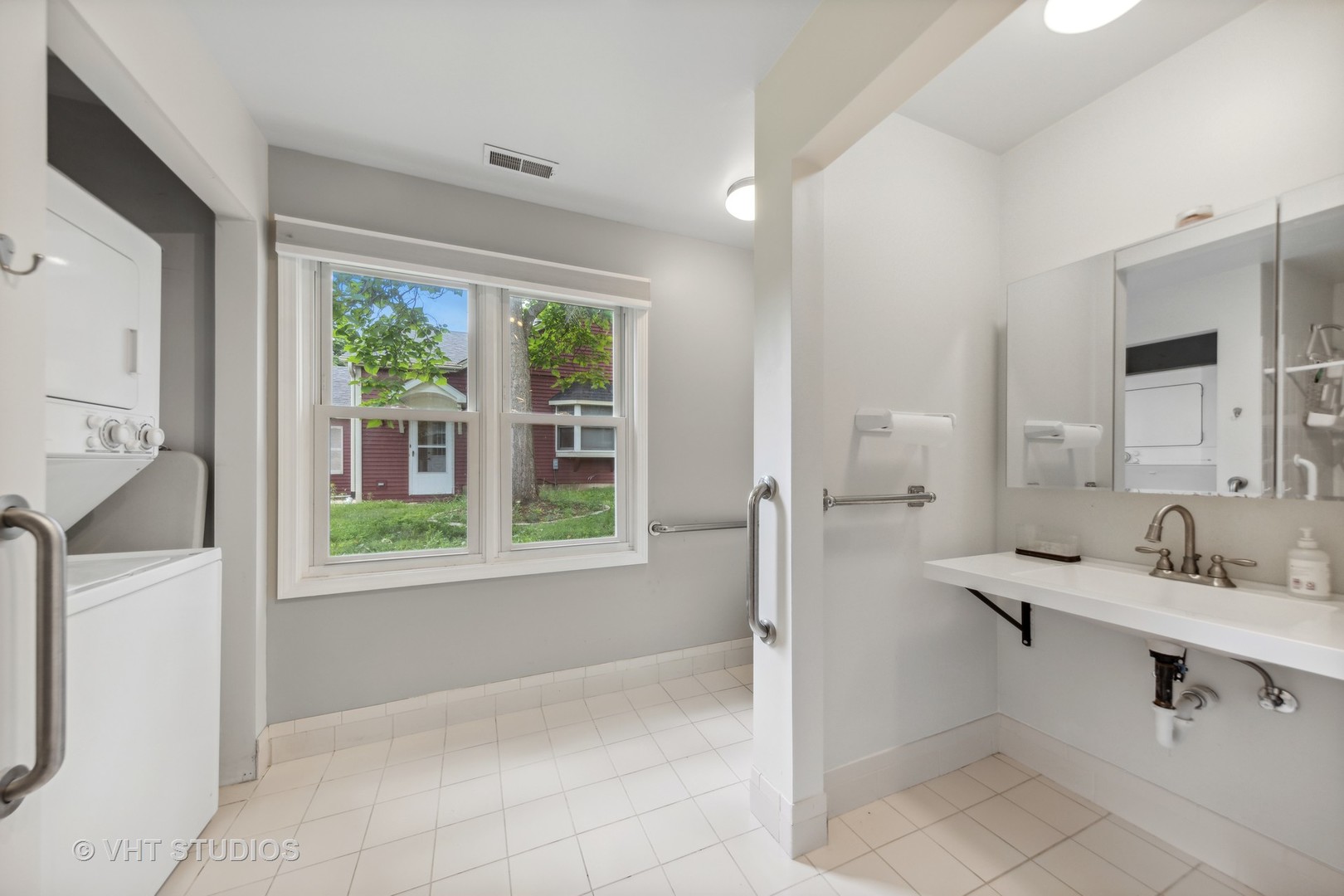 831 Warrenville Road Wheaton, IL 60189 - Photo 9 of 26 a bathroom with a sink and a mirror