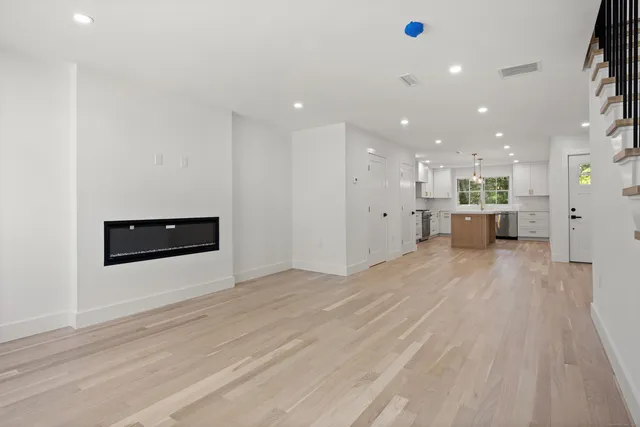 a kitchen with a sink stove and refrigerator