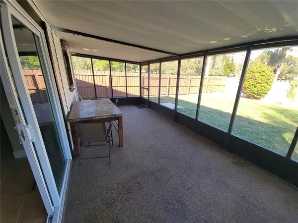 a view of a room with a large window