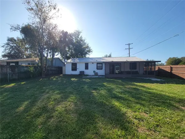 a view of a house with a back yard