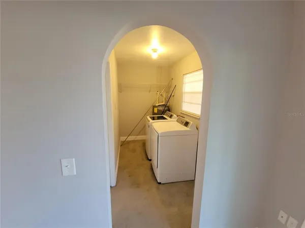 a view of a room with washer and dryer