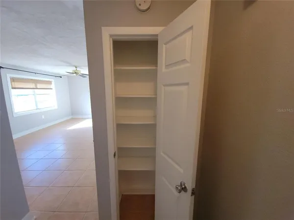 a view of hallway with window and stairs