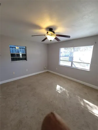 a view of an empty room with a window