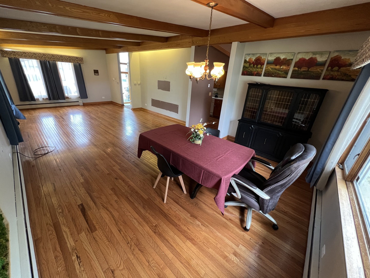 616 Seneca Drive Aurora, IL 60506 - Photo 9 of 36 a living room with furniture a table and wooden floor