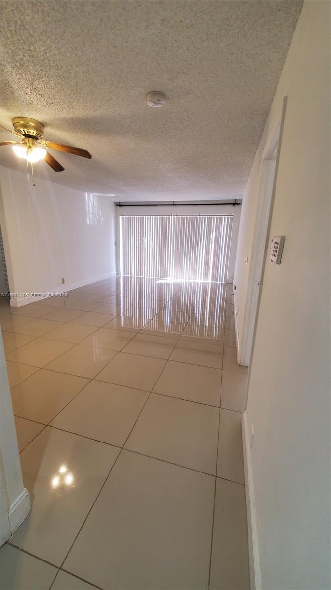 9055 Wiles Road, Unit 103 Coral Springs, FL 33067 - Photo 11 of 19 a view of an empty room