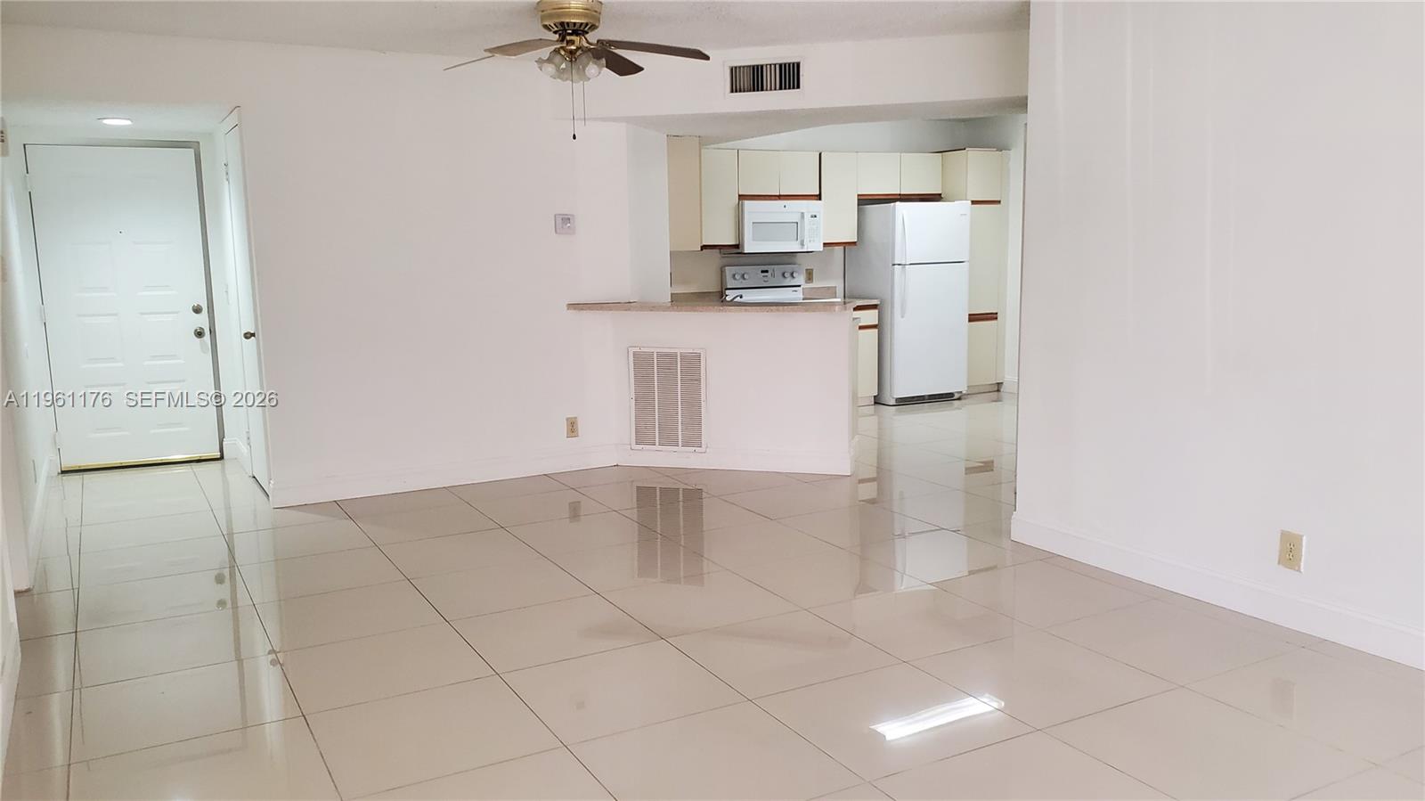9055 Wiles Road, Unit 103 Coral Springs, FL 33067 - Photo 13 of 19 a view of a kitchen with a sink
