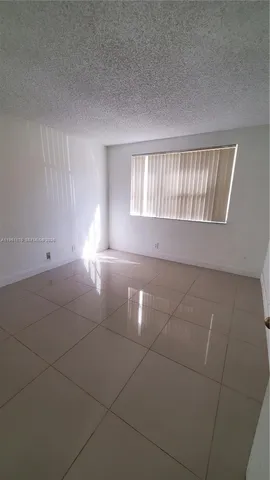 $260,000 | 9055 Wiles Road, Unit 103, Coral Springs, FL 33067