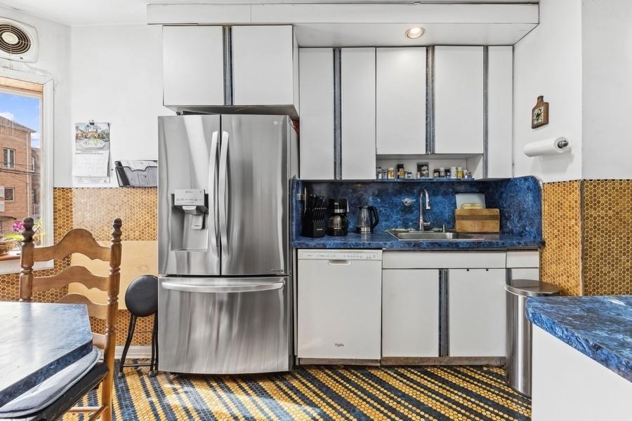 108-28 65th Road Queens, NY 11375 - Photo 7 of 15 a kitchen with granite countertop a refrigerator and a sink