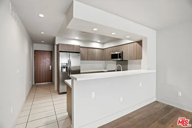 a view of a kitchen with a sink