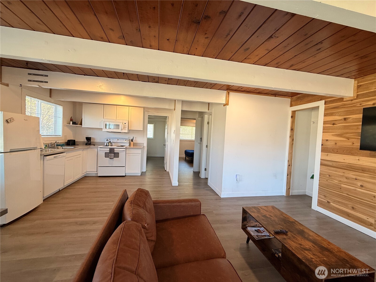 141 Barnacle Street Ocean Shores, WA 98569 - Photo 11 of 27 a living room with furniture and kitchen view