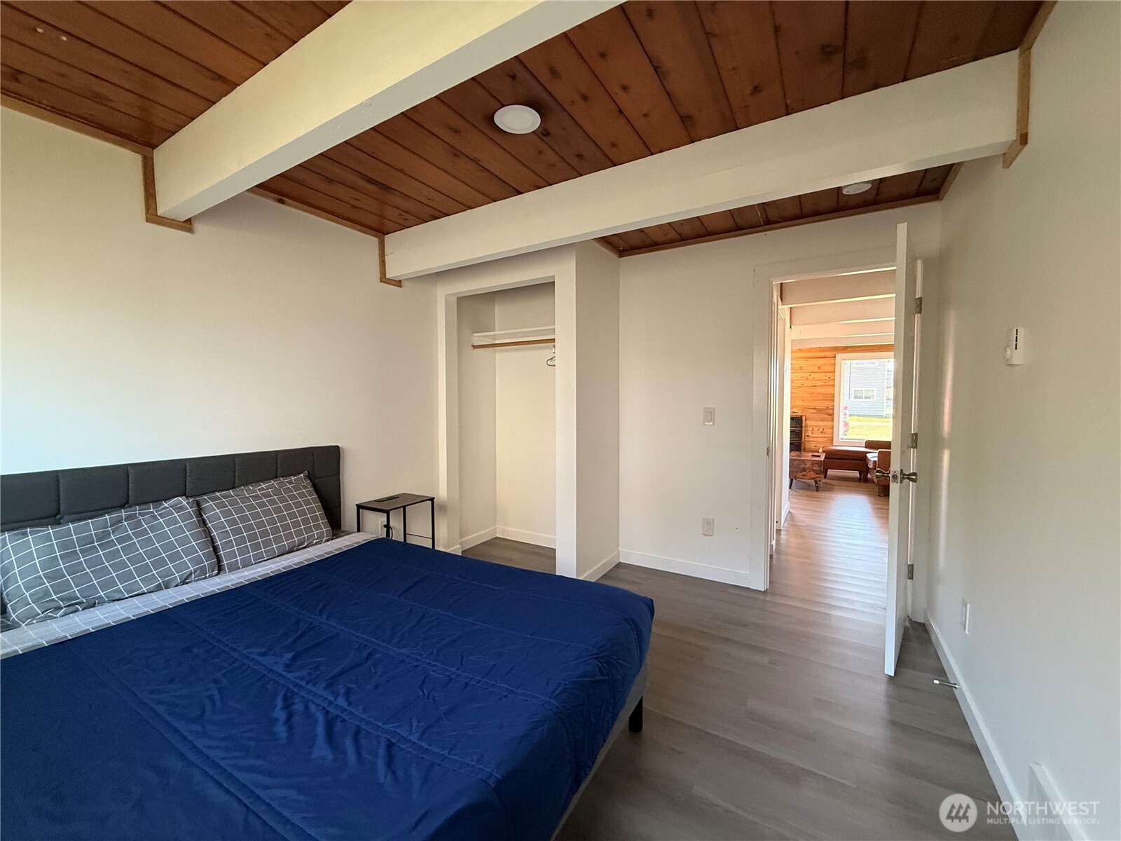 141 Barnacle Street Ocean Shores, WA 98569 - Photo 16 of 27 a bedroom with a bed and a view of bedroom