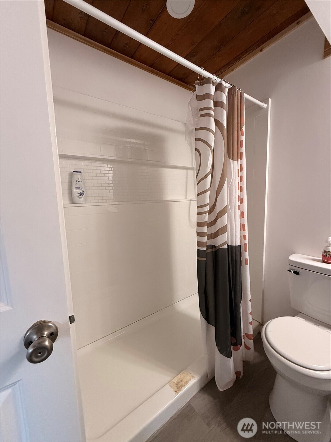 141 Barnacle Street Ocean Shores, WA 98569 - Photo 18 of 27 a bathroom with a shower and a toilet