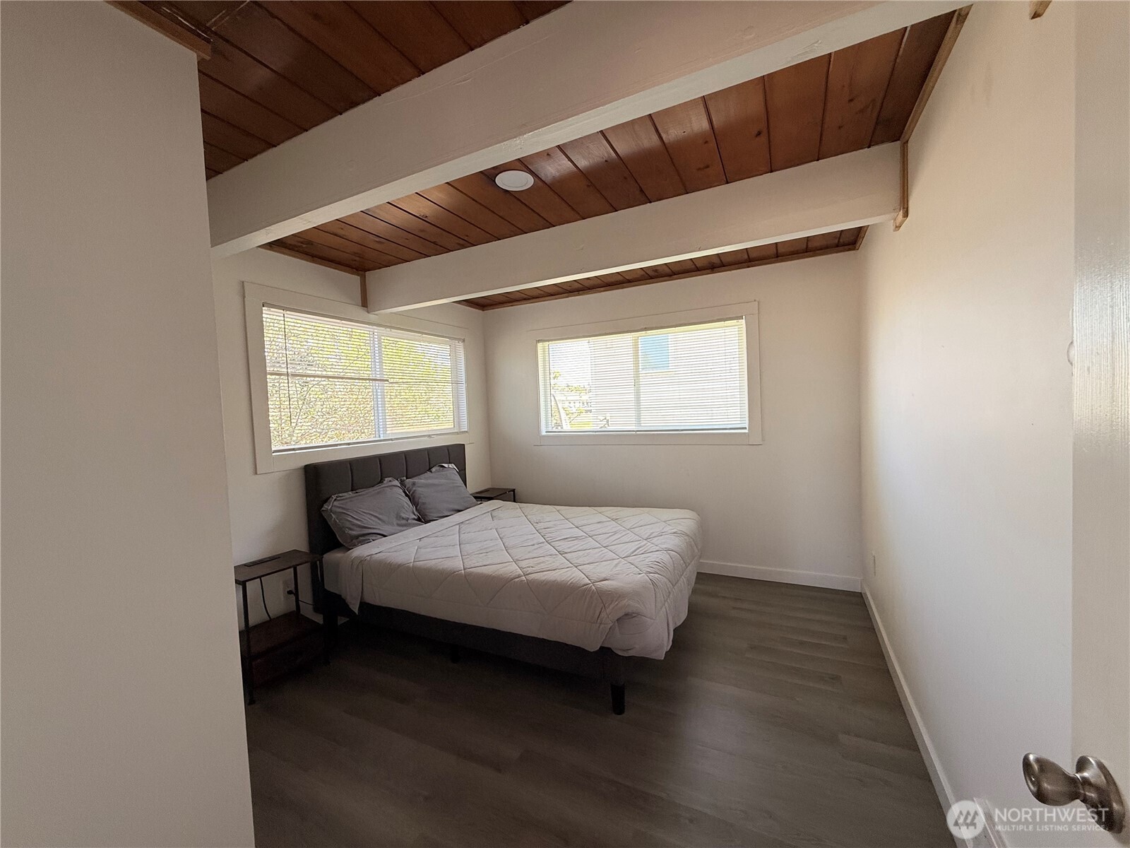 141 Barnacle Street Ocean Shores, WA 98569 - Photo 19 of 27 a bedroom with a bed and window
