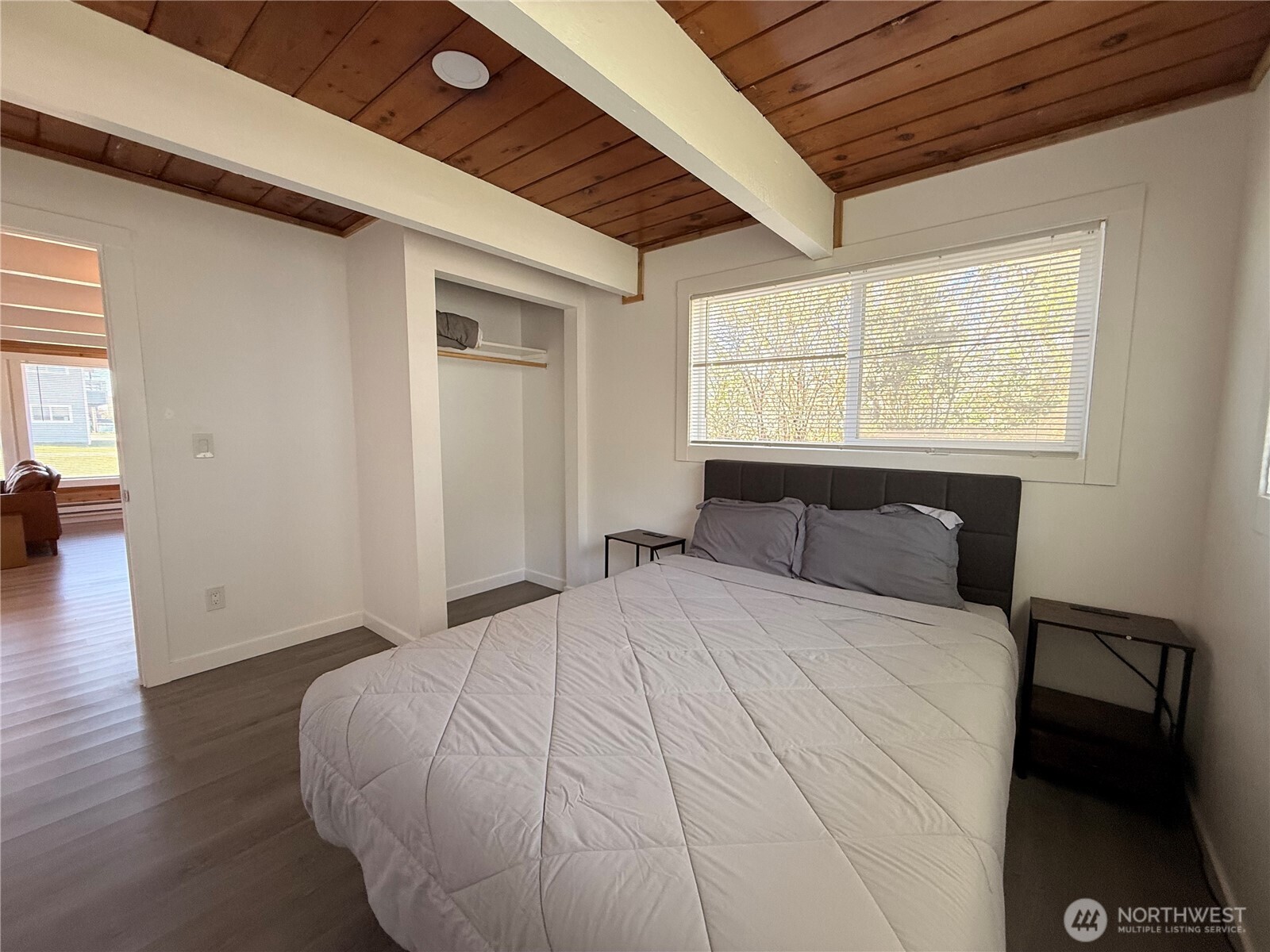 141 Barnacle Street Ocean Shores, WA 98569 - Photo 21 of 27 a large bed sitting in a bedroom next to a window