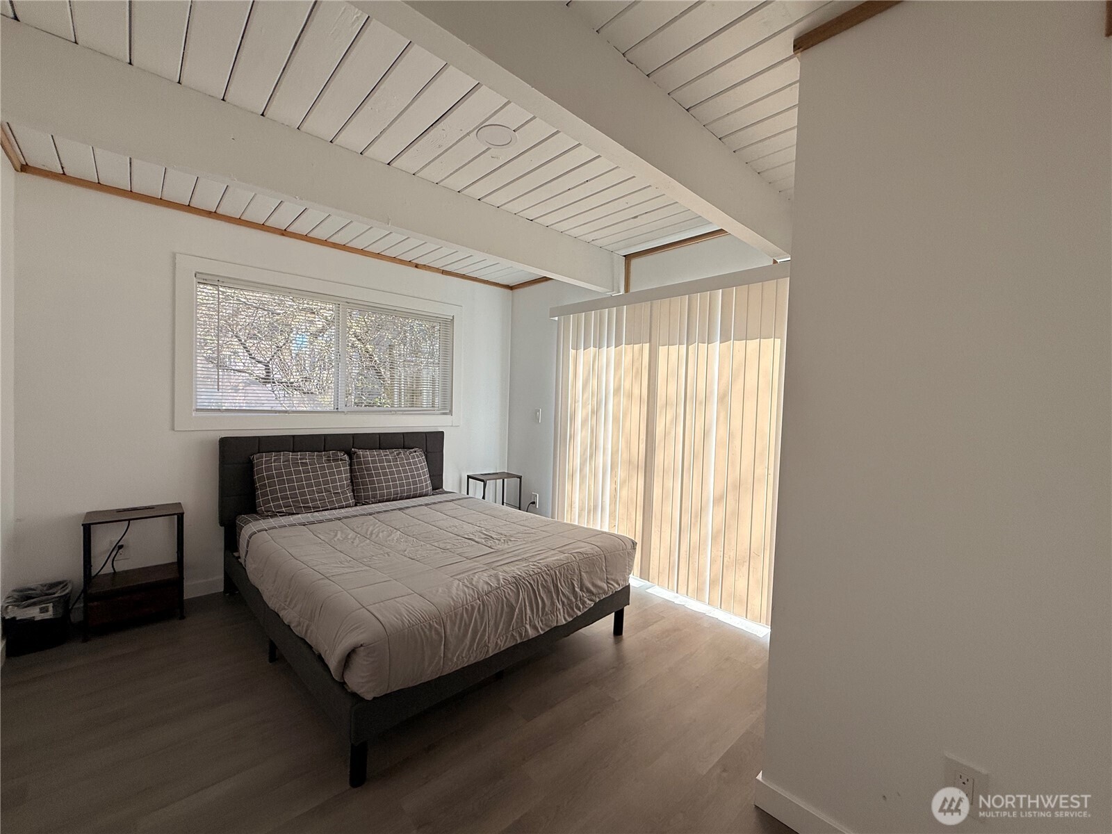 141 Barnacle Street Ocean Shores, WA 98569 - Photo 22 of 27 a bedroom with a bed and window